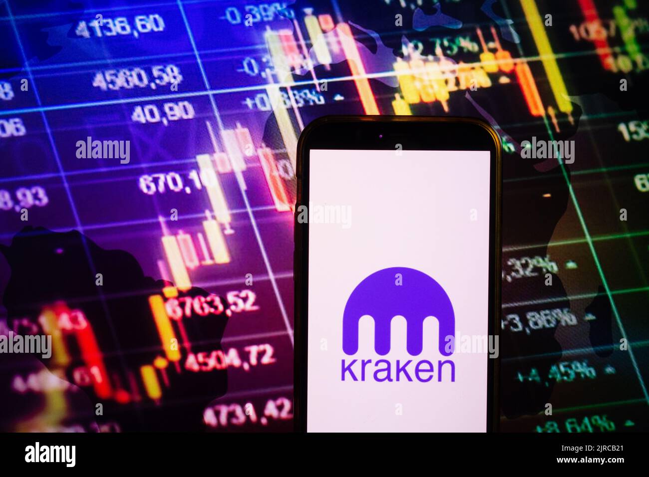 Kraken is cryptocurrency exchange. A smartphone with the Kraken logo metal  coins, bitcoin, ethereum on a laptop keyboard Stock Photo - Alamy