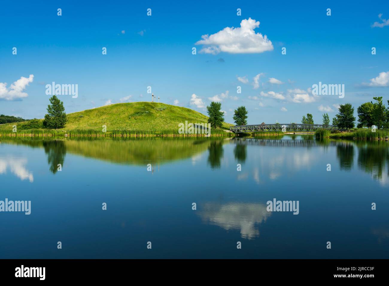 A calm lake with reflections at the Winkler Bible Camp, Winkler, Manitoba, Canada Stock Photo