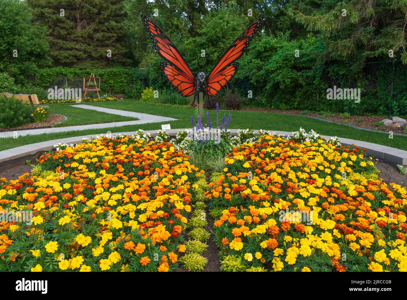 A flower garden and butterfly sculpture at the Butterfly Gardens near