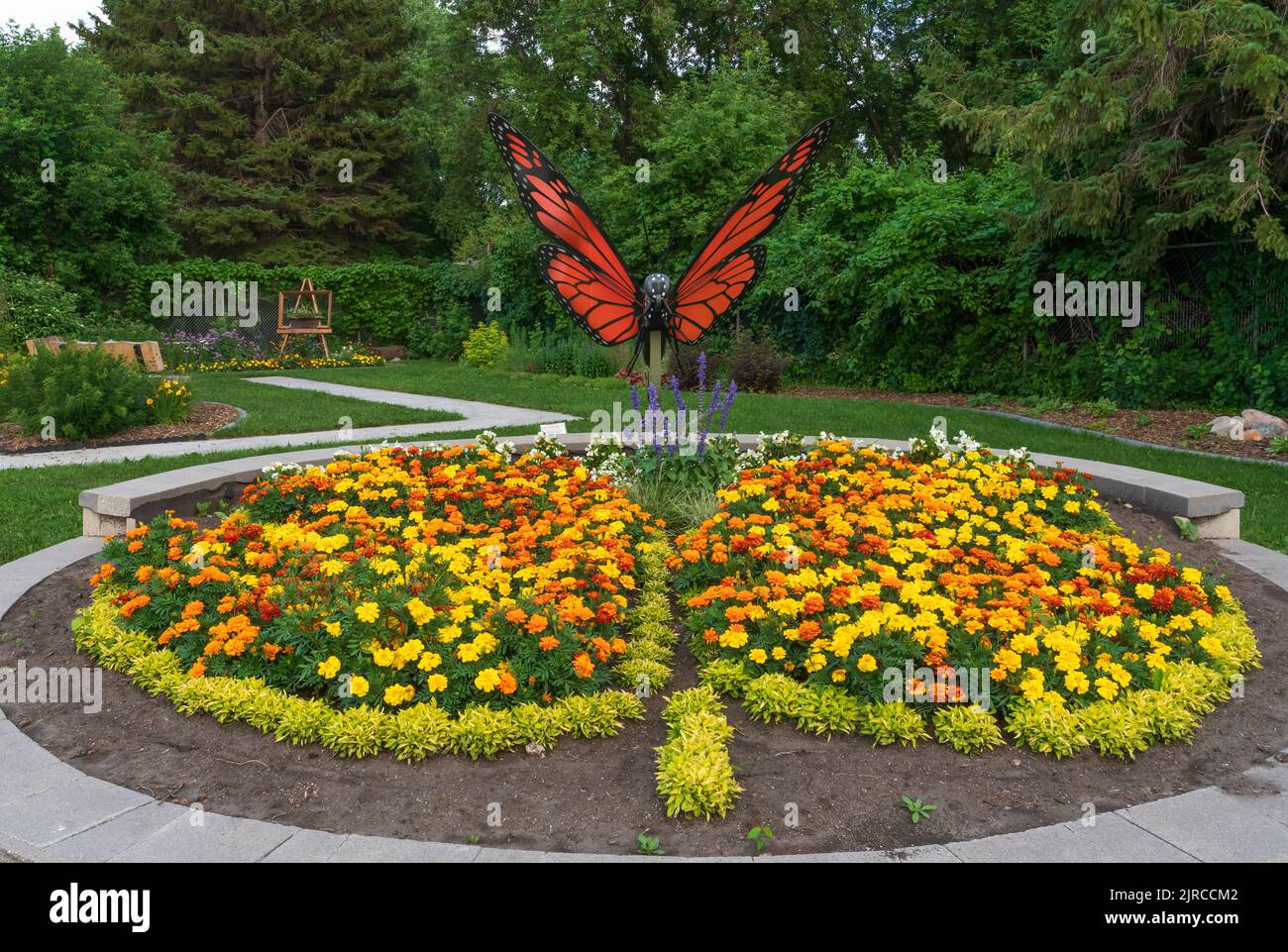 A flower garden and butterfly sculpture at the Butterfly Gardens near