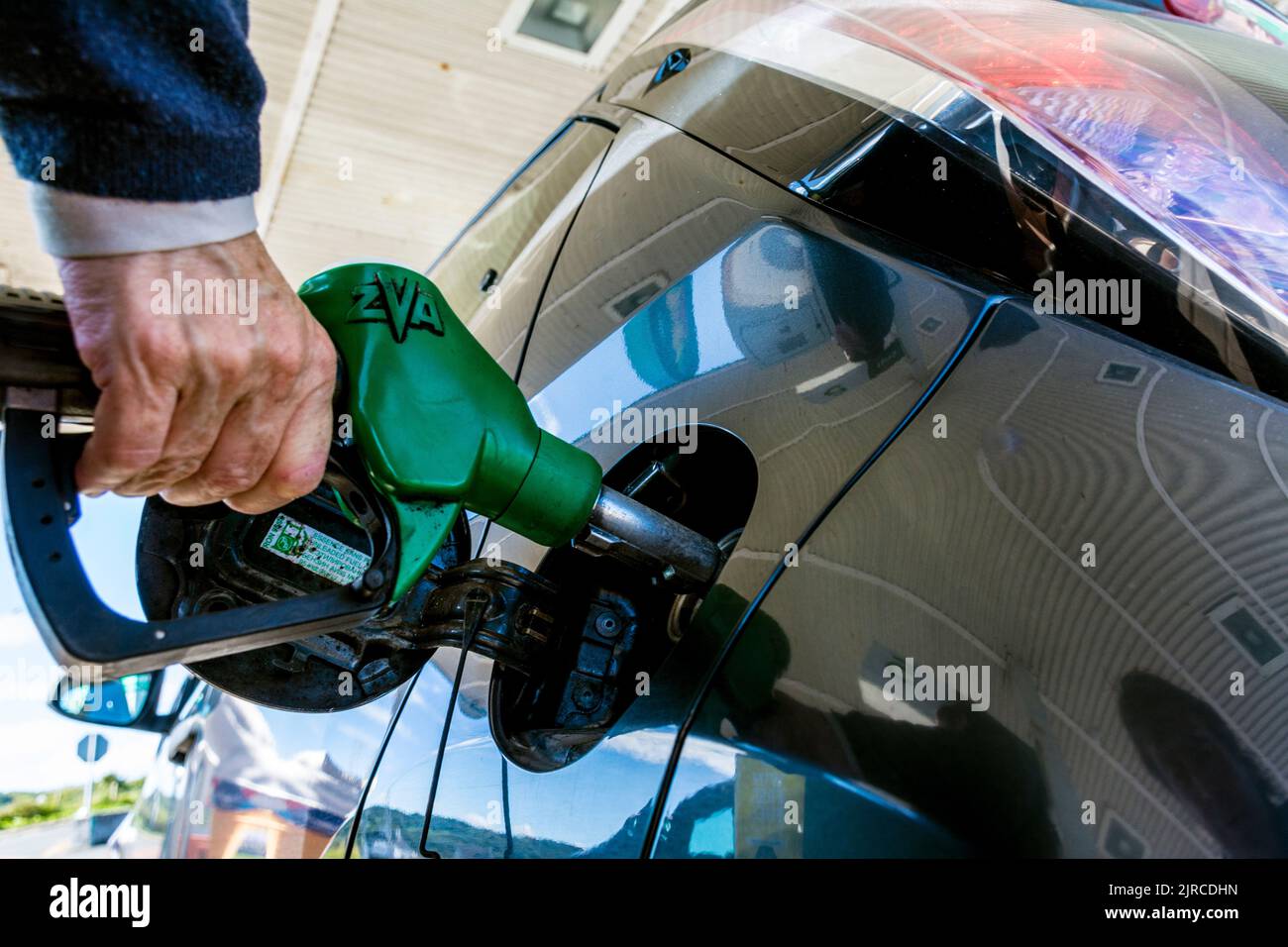 Filling a car with fuel petrol gasoline in County Donegal, Ireland. Stock Photo