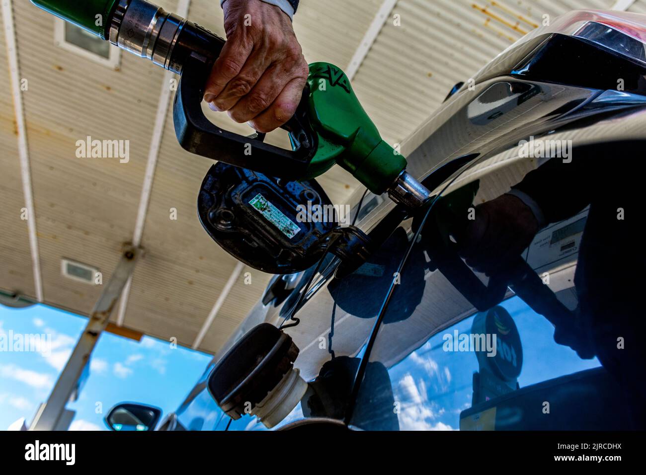 Filling a car with fuel petrol gasoline in County Donegal, Ireland. Stock Photo