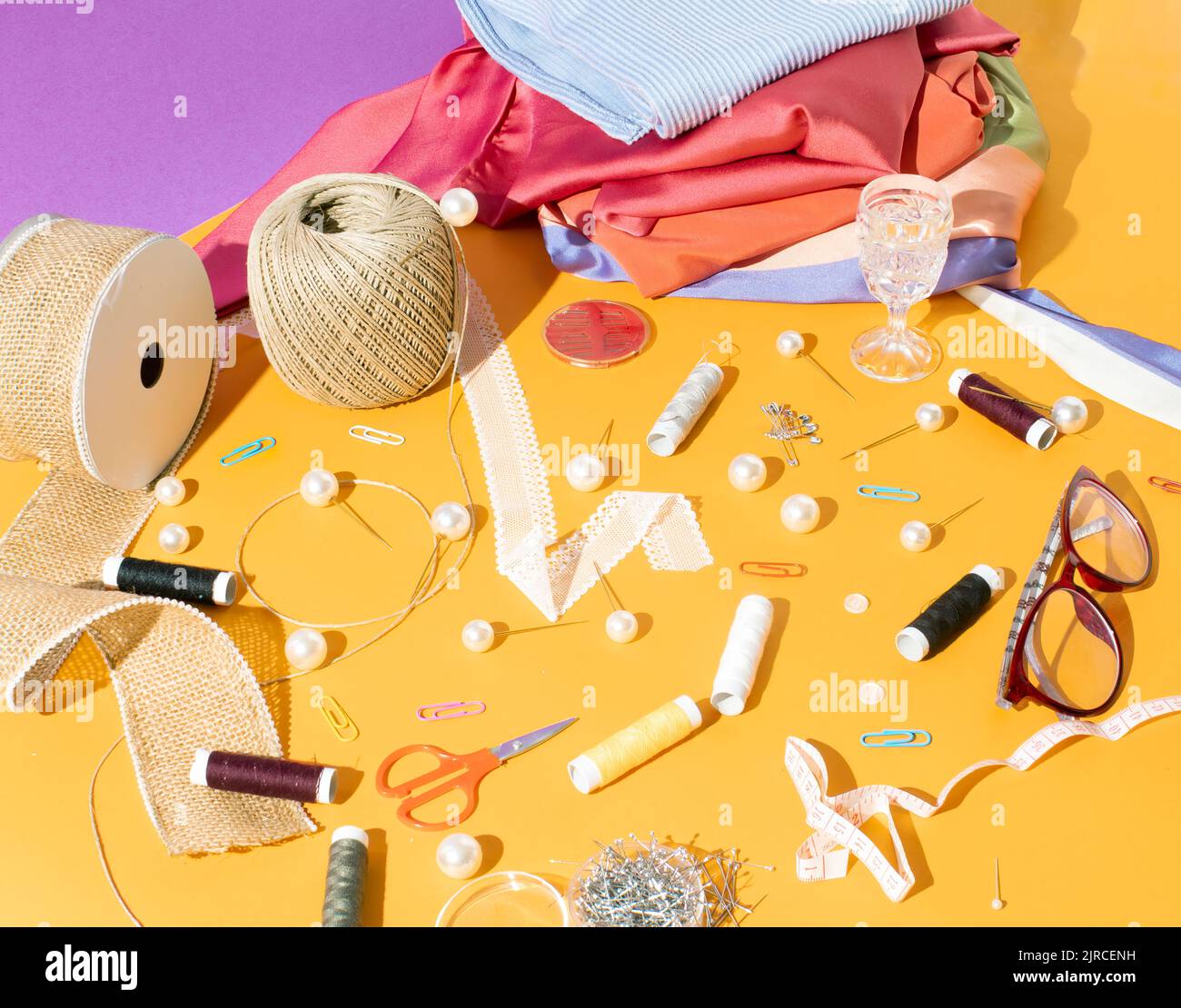 Composition with threads and sewing accessories isolated on white  background. Sewing pattern. Flat lay, top view Stock Photo - Alamy