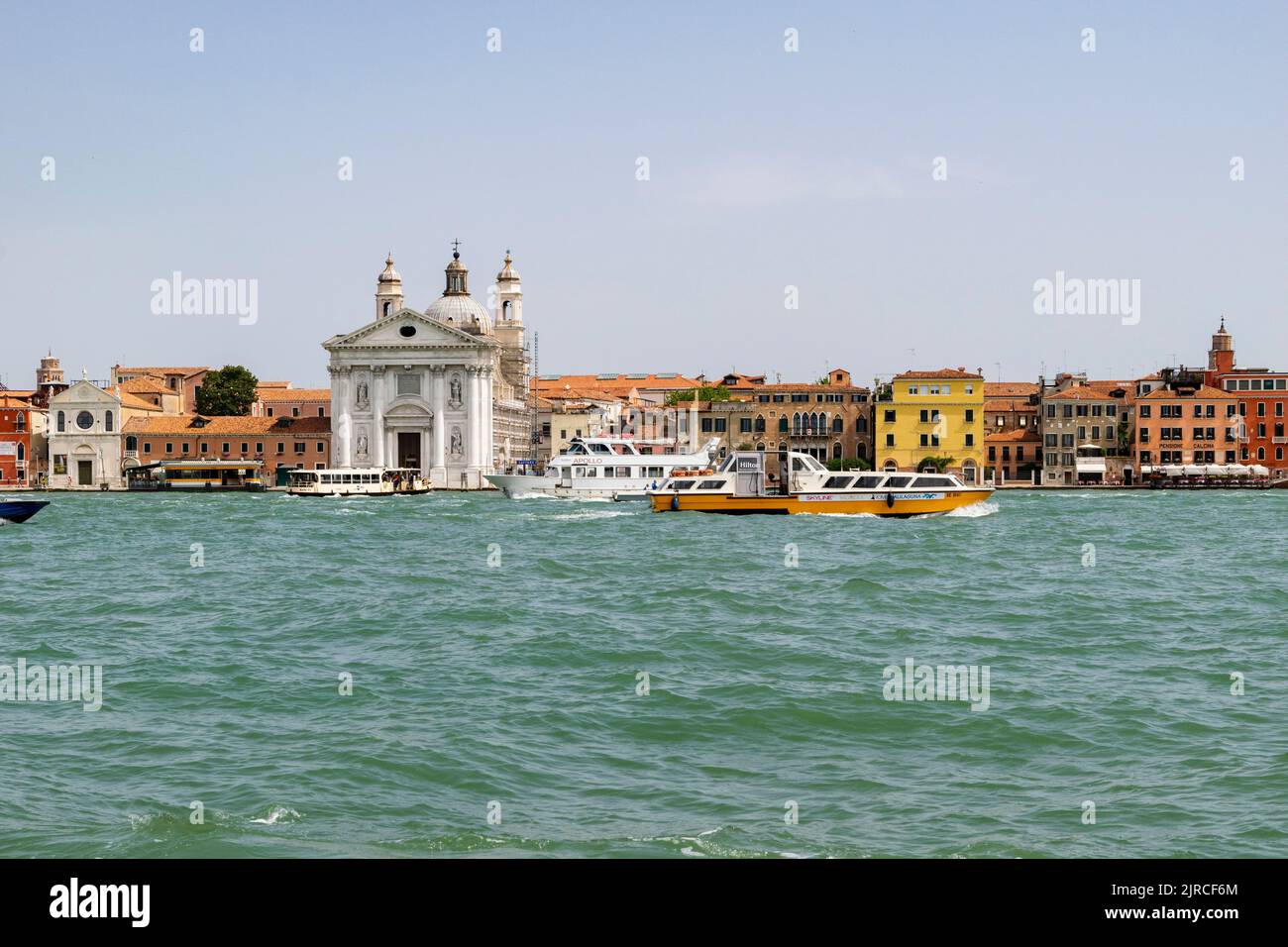 A landscape view of the Venice main channel, the Zattere vaporetto stop and the Santa Maria del Rosario church at Venice, Italy Stock Photo