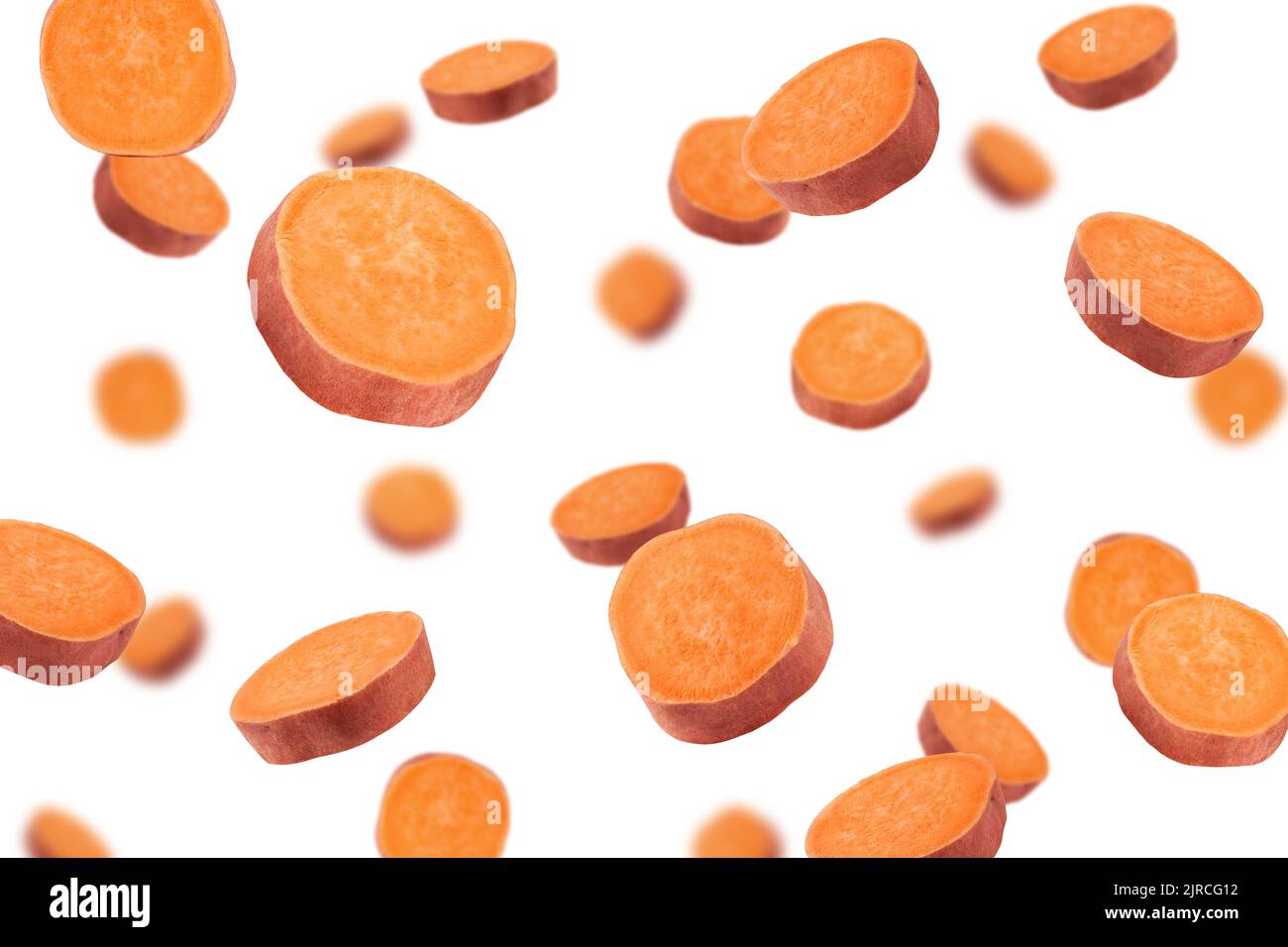Falling sweet potato, slice, isolated on white background, selective focus Stock Photo
