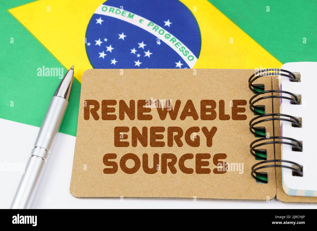 Brazil Sources National ecology concept. On the flag of Brazil lies a notebook with ...