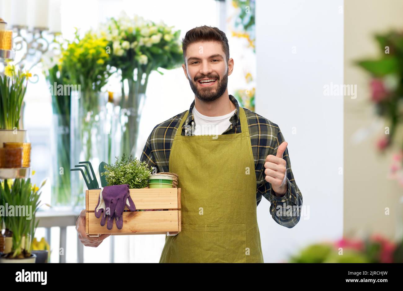 happy gardener or farmer with box of garden tools Stock Photo - Alamy
