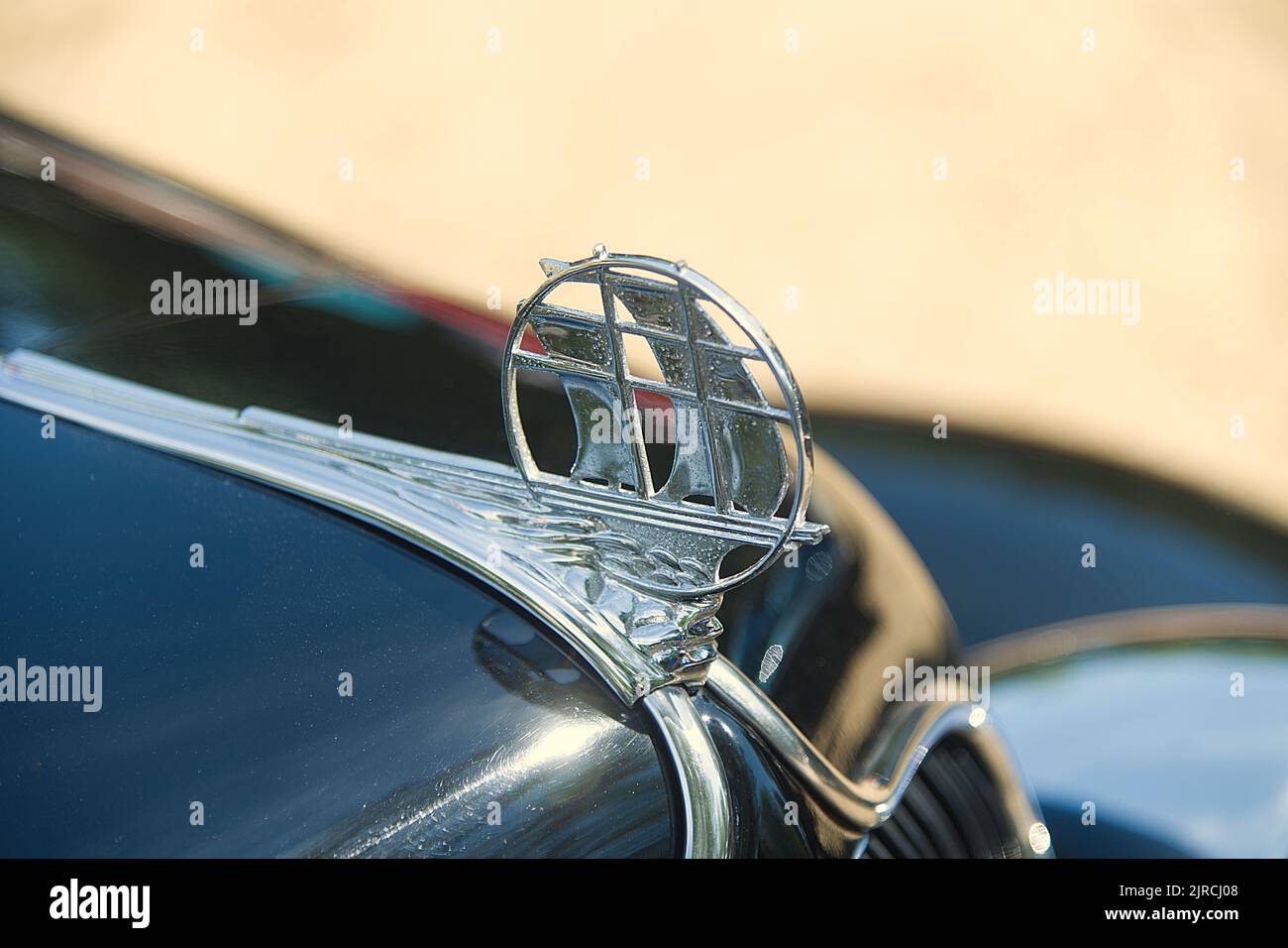 The hood ornament on a restored 1940's Plymouth in an antique auto parade in Dennis, Massachusetts, Cape Cod, USA Stock Photo
