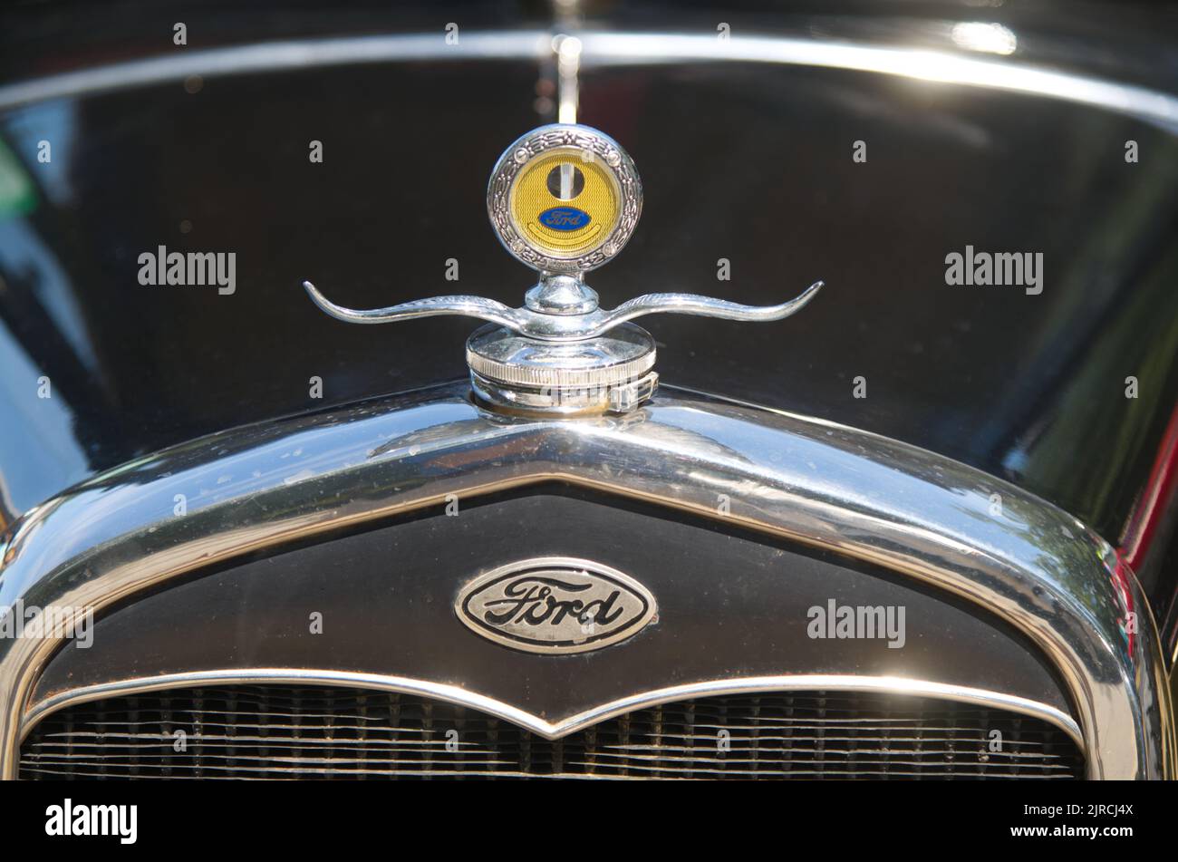 A Ford Emblem and temperature gauge on an antique Ford in an auto parade in Dennis, Massachusetts, Cape Cod, USA Stock Photo