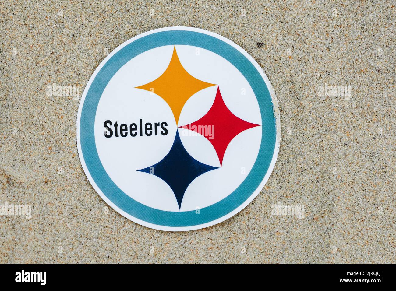 September 15, 2021, Moscow, Russia. The emblem of the Pittsburgh Steelers football club on the sand of the beach. Stock Photo
