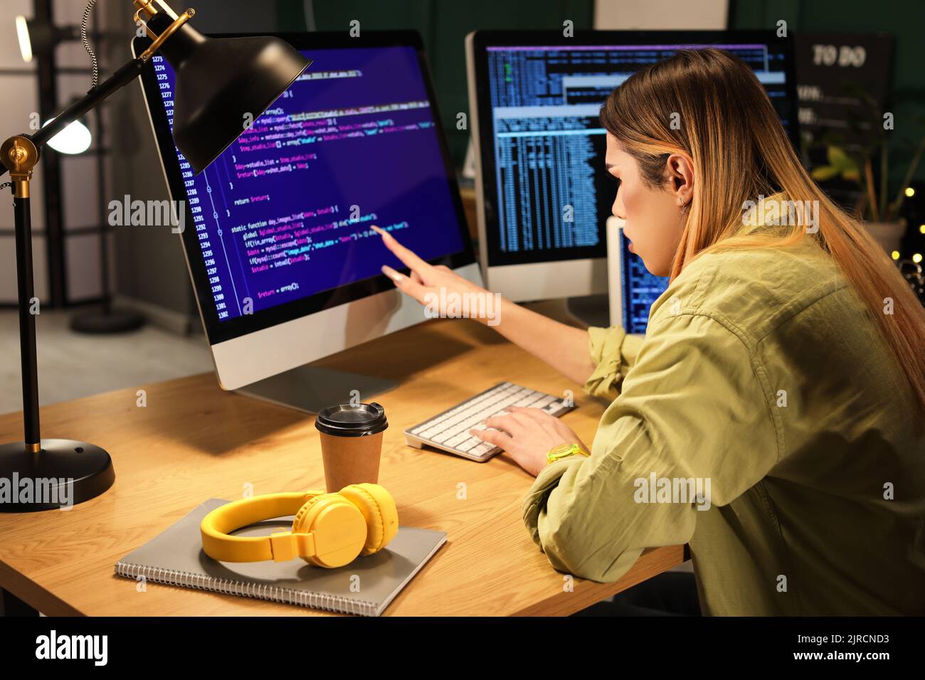 Transgender programmer working in server room Stock Photo - Alamy