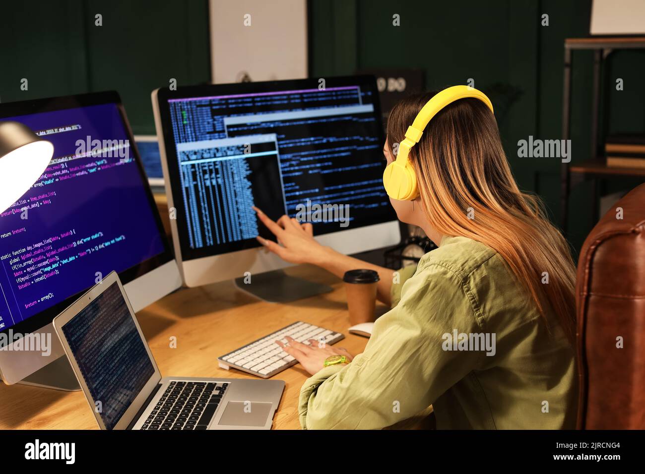 Transgender programmer working in server room Stock Photo - Alamy