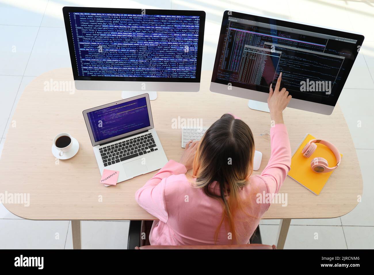 Transgender programmer working in office Stock Photo - Alamy