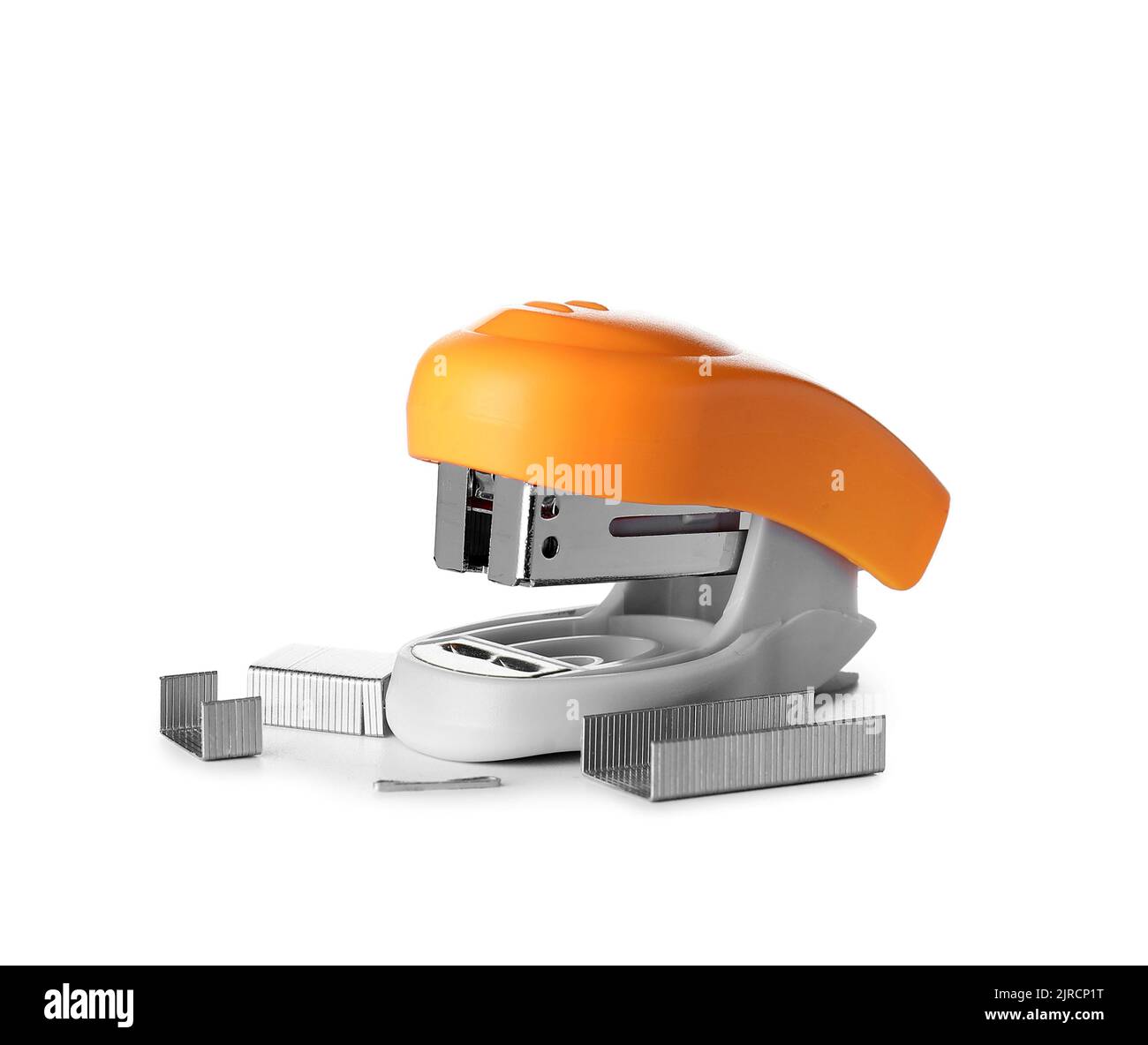 Orange stapler with staples on white background Stock Photo Alamy