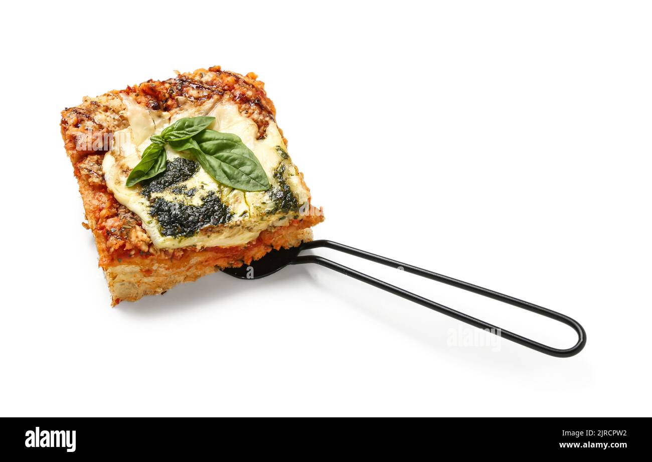 Spatula with piece of tasty Italian pie on white background Stock Photo