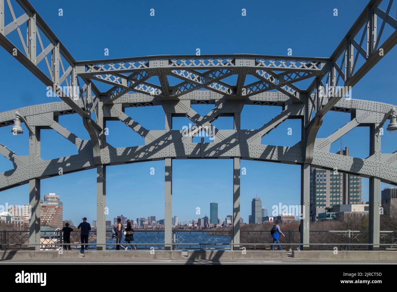 Boston, MA, US-August 10, 2022:  People cross the BU bridge with view of skyline in background. Stock Photo