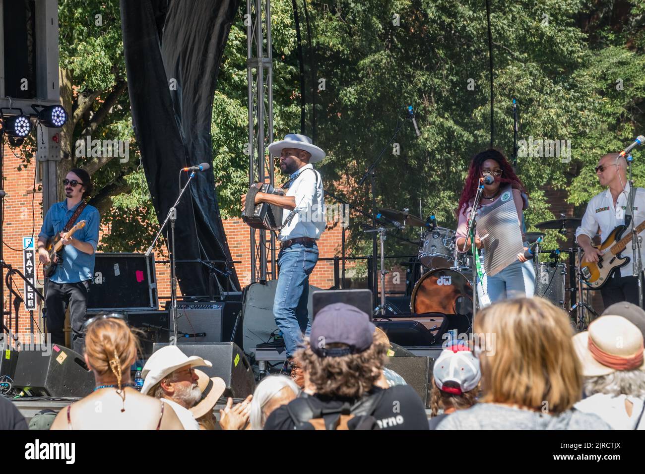 Lowell, Massachusetts, US-July 30, 2022: Cedric Watson and Bijou Creole, a zydeco band perform at the Lowell Folk Festival- a free outdoor festival. Stock Photo