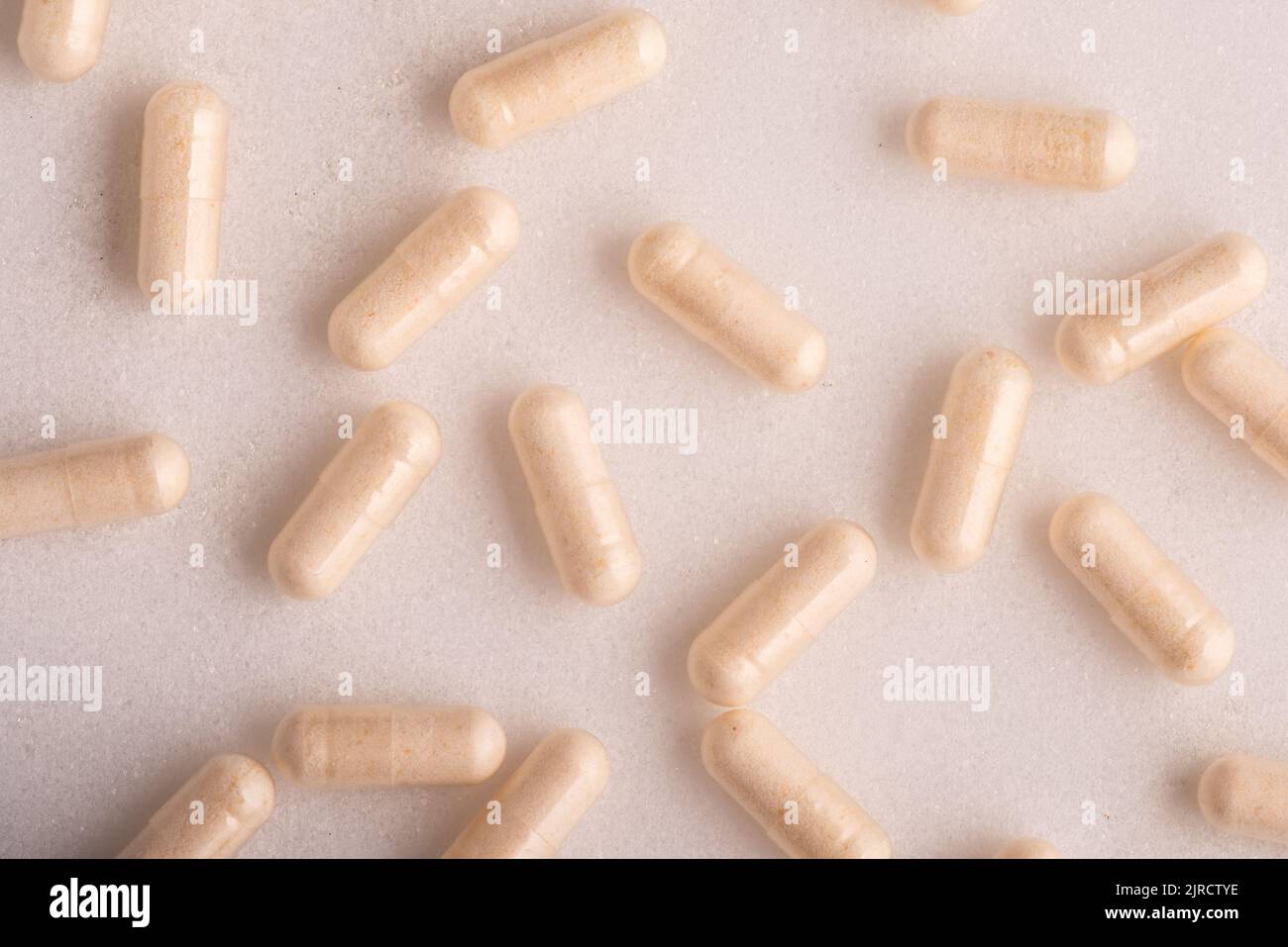 Vitamin pills on clean white background Stock Photo