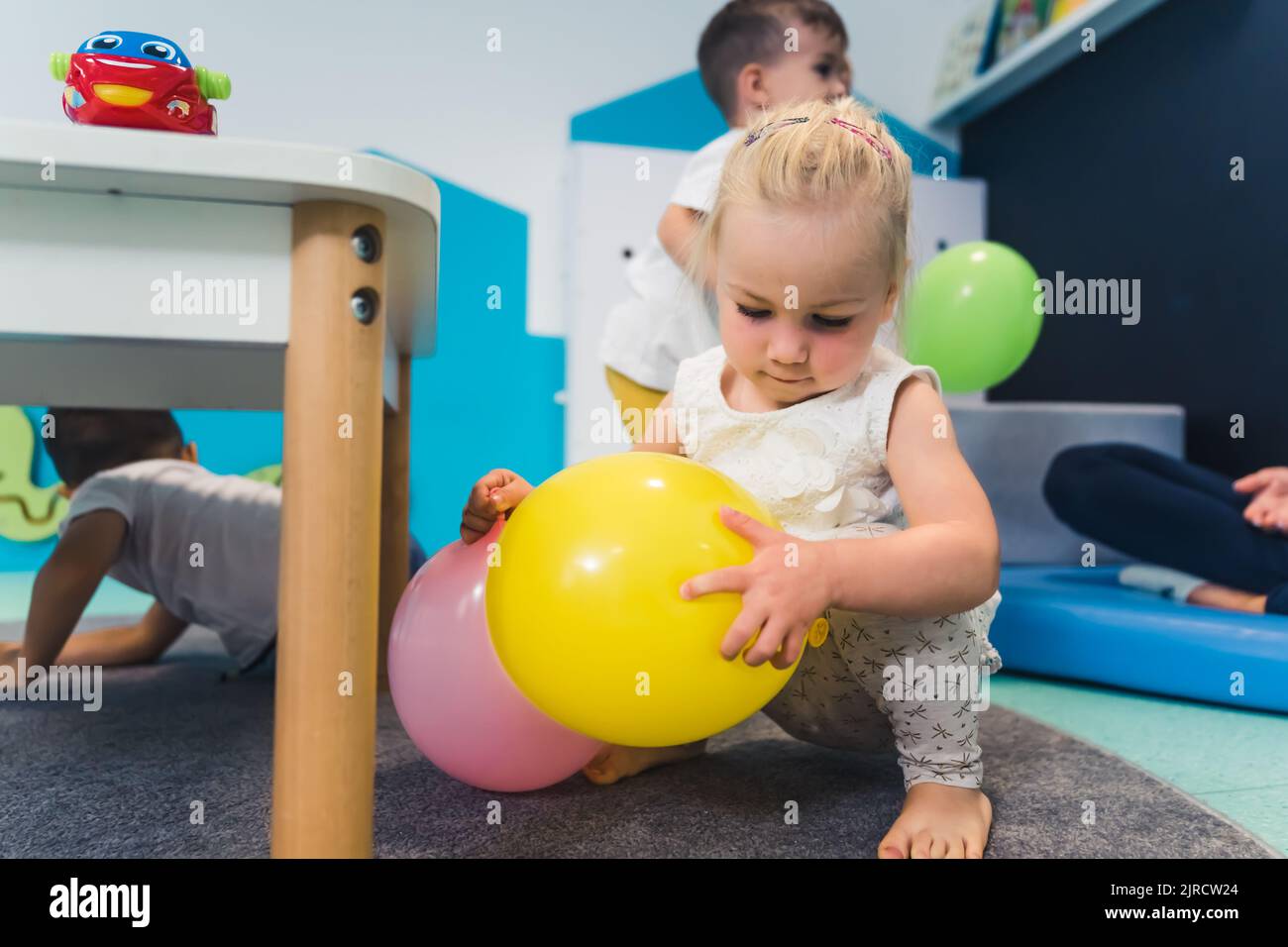 kids playing with balloons in the nursery. High quality photo Stock Photo