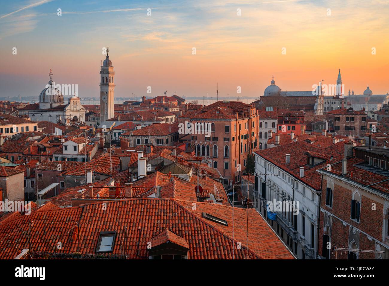 Venice; Italy rooftop skyline towards San Giorgio dei Greci and its leaning bell tower. Stock Photo