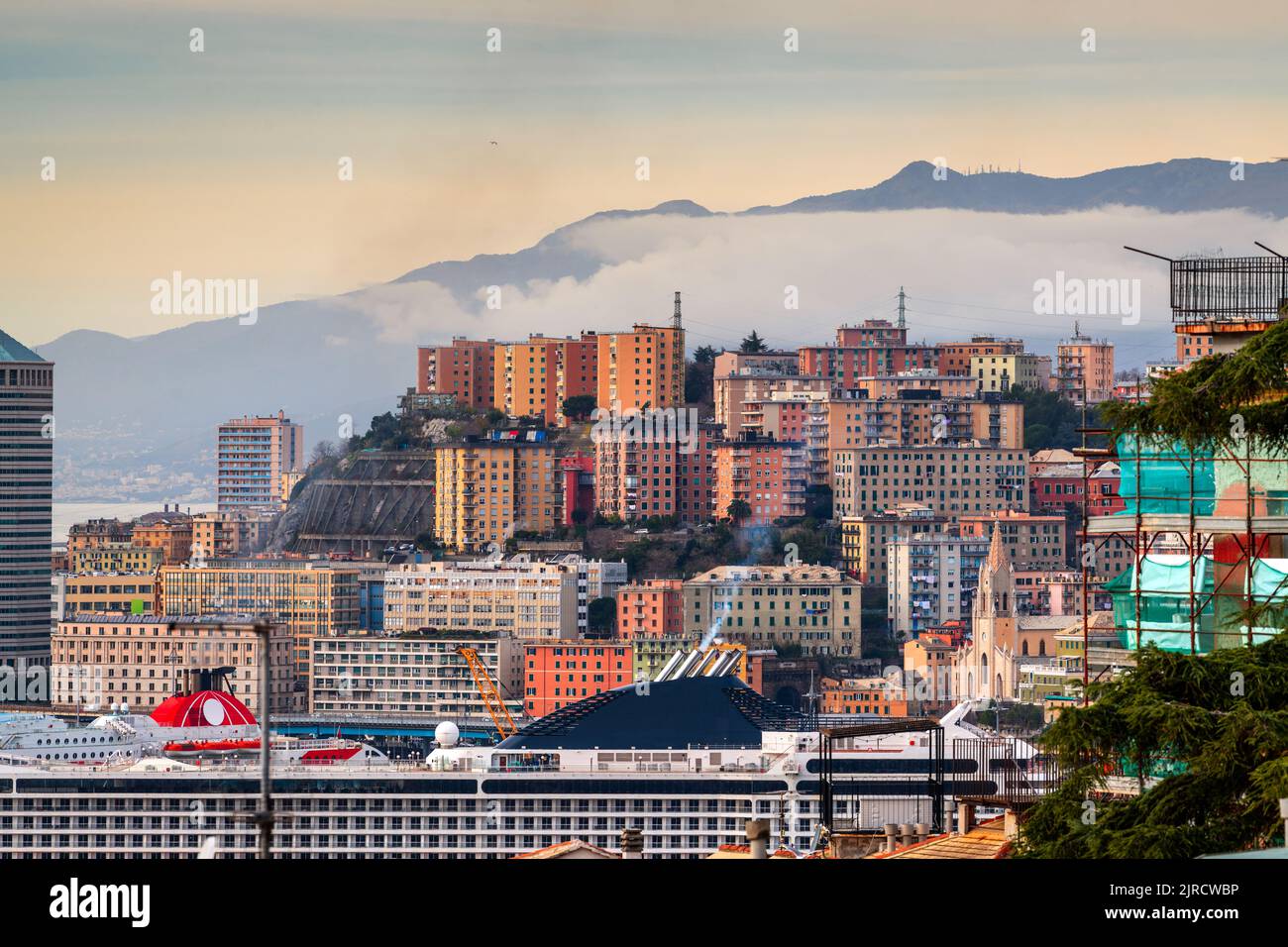 Genova, Italy cityscape wity misty mountains. Stock Photo