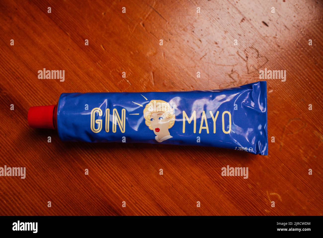 a bright cobalt blue tube of Gin Mayo, a Dutch mayonnaise flavored with Gin Stock Photo