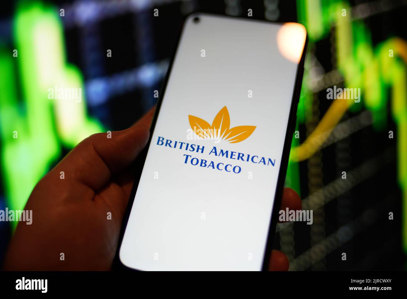The British American Tobacco logo is seen on a Redmi phone screen in this photo illustration in Warsaw, Poland on 23 August, 2022. Stock Photo