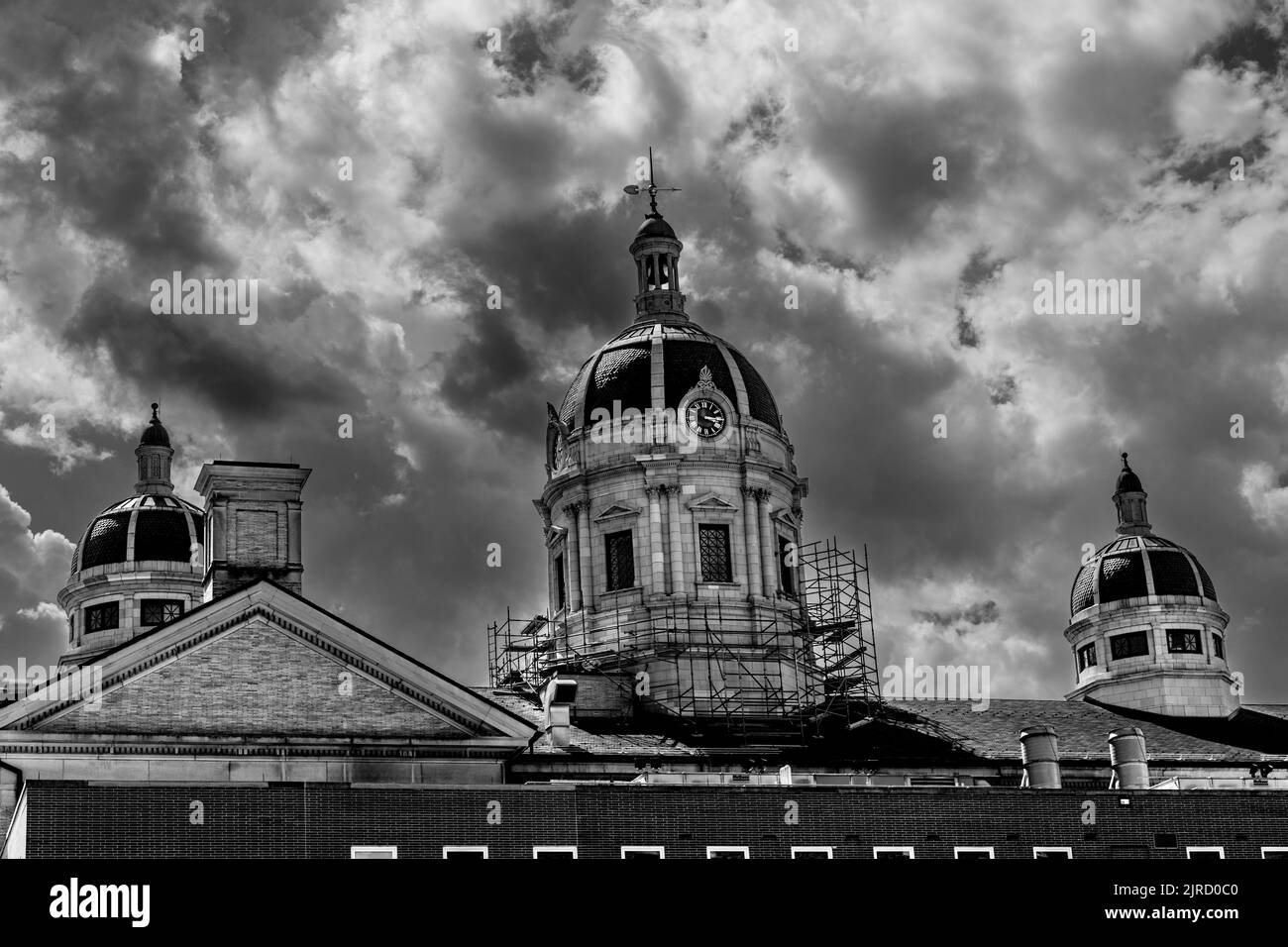 This is a black and white image of the top of an ornate building