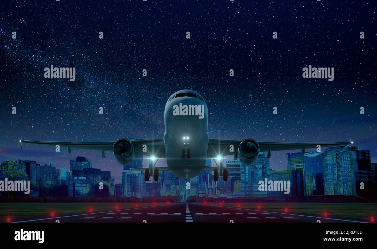 Commercial airplane Take at night off on airport runway with city in ...