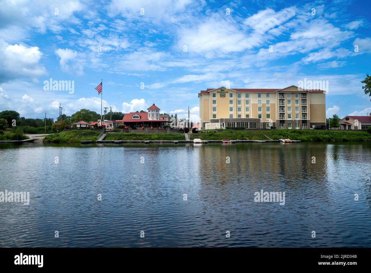 Schenectady, NY – USA - Aug 5, 2022 Horizontal afternoon view of the Homewood Suites by Hilton in Schenectady, set along the Mohawk River, this relaxe Stock Photo