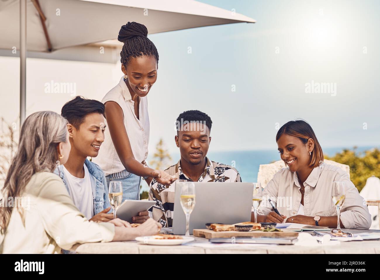 Champagne, luxury and friends at a sea restaurant to celebrate