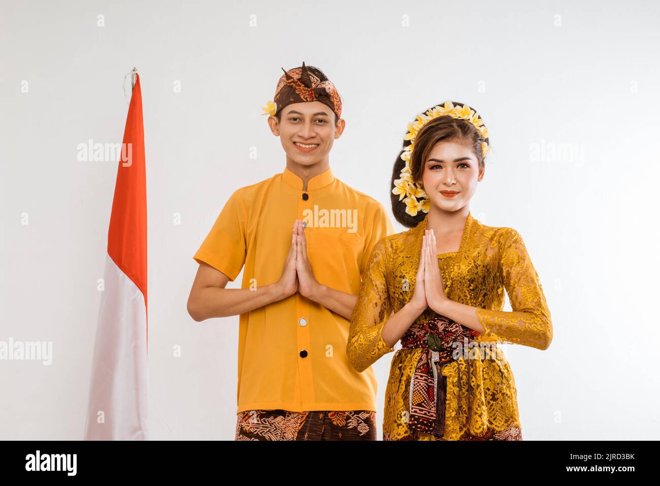balinese couple with greeting gesture to camera Stock Photo