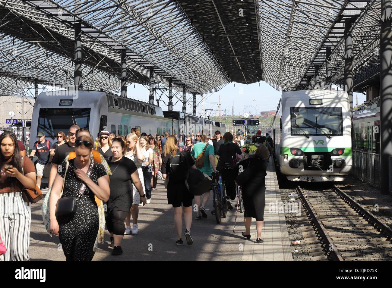 Helsinki, Finland - August 20, 2022: Arriving passengers at the Helsinki Central railroad station. Stock Photo