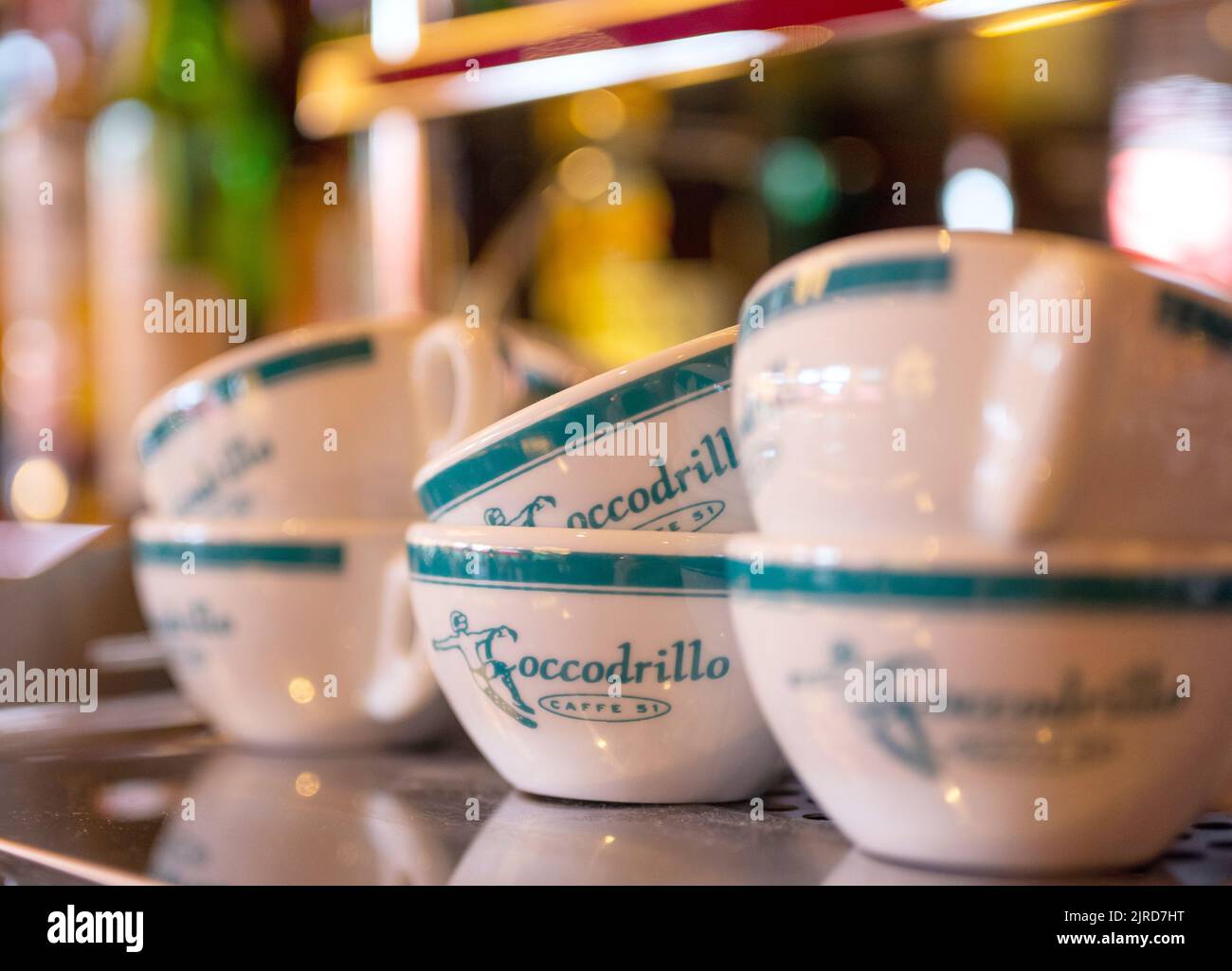 Berlin, Germany. 19th Aug, 2022. Cups with 'Coccodrillo' printed on them stand on a coffee machine in the dining room at the 'Coccodrillo' restaurant in Weinbergspark. The main thing 'instagrammable' seems to be the motto of some new eateries. (to dpa-Korr 'Overwhelming': How the Instagramming of the restaurant world continues') Credit: Monika Skolimowska/dpa/Alamy Live News Stock Photo