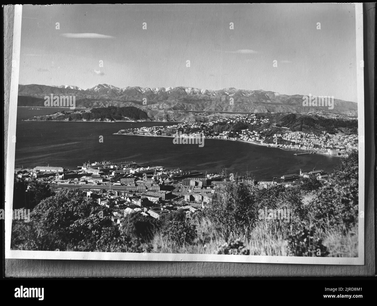 Wellington Harbour : looking east from Tinakori Hill, 1935-1939, Tararua Range, by Leslie Adkin. Stock Photo