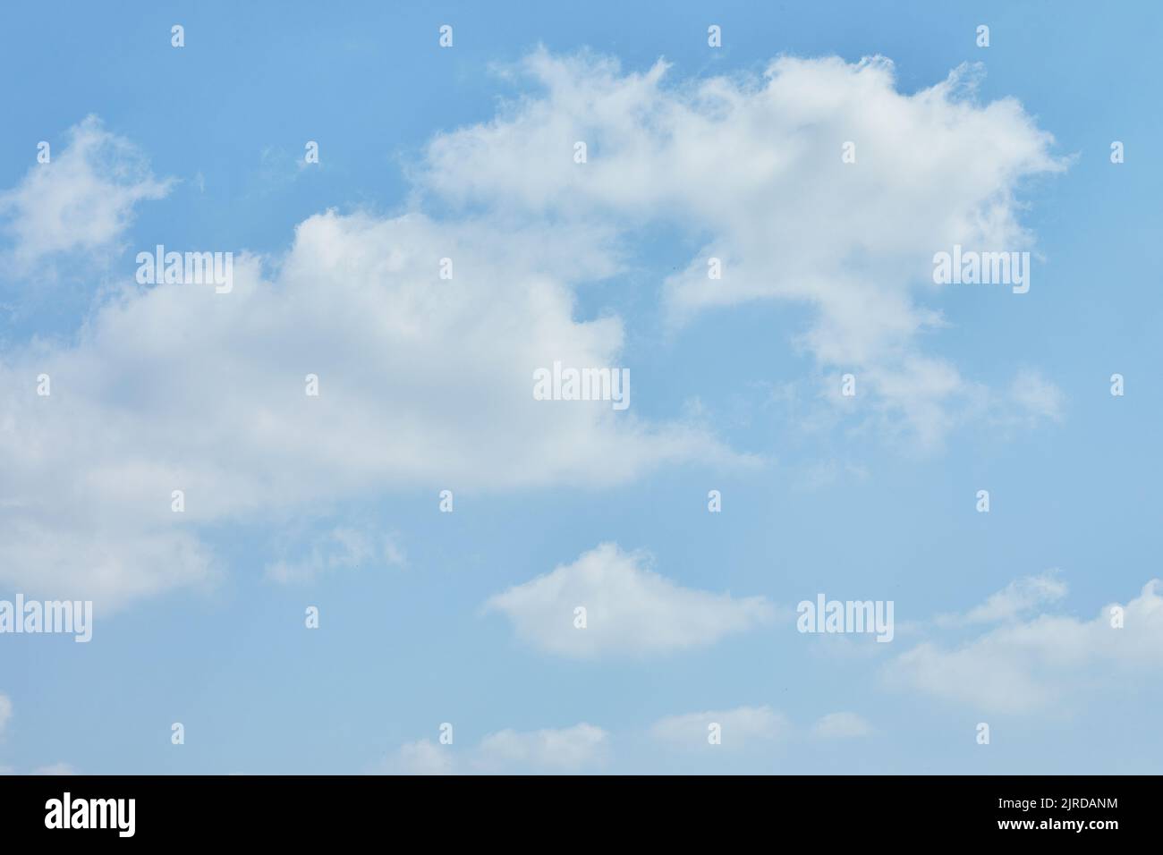 Blue sky texture with white clouds for background. Stock Photo
