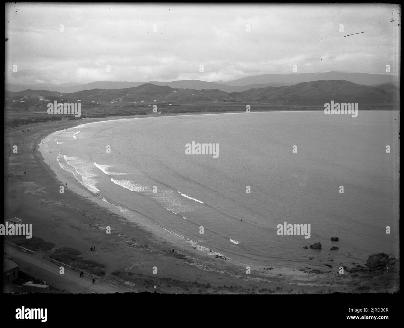 Kilbirnie isthmus, separating Evans Bay and Lyall Bay, from Houghton Terrace, 22 January 1913, by Leslie Adkin. Stock Photo