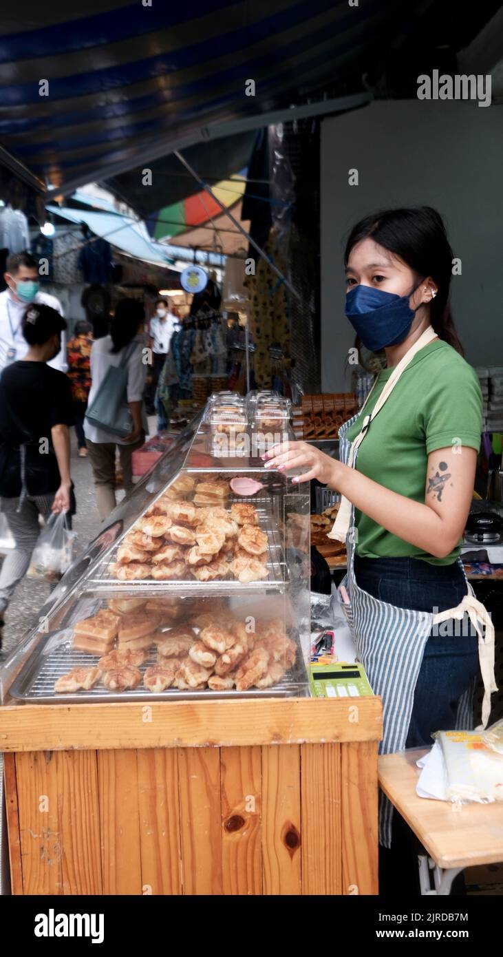 Female Sidewalk Street Food Vendor on Petuberri Road in Bangkok Thailand Stock Photo