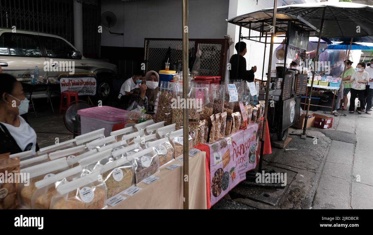 Sidewalk Street Food Vendor on Petuberri Road in Bangkok Thailand Stock Photo