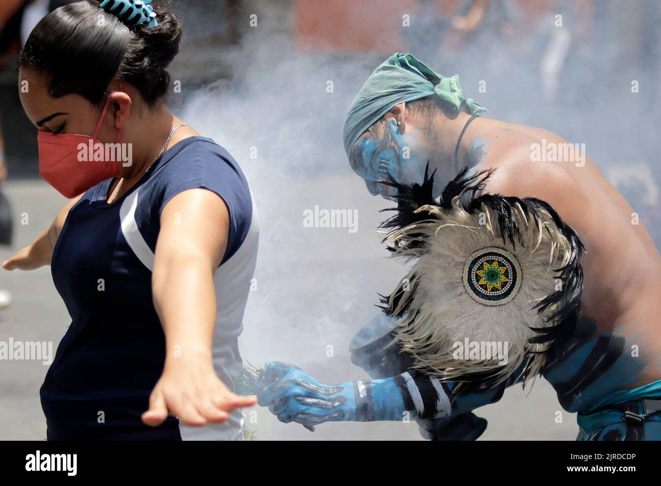 Aztec Ritual Washing Mexico City, DF, Mexico. 23rd Aug, 2022. A woman gets purified by one ...