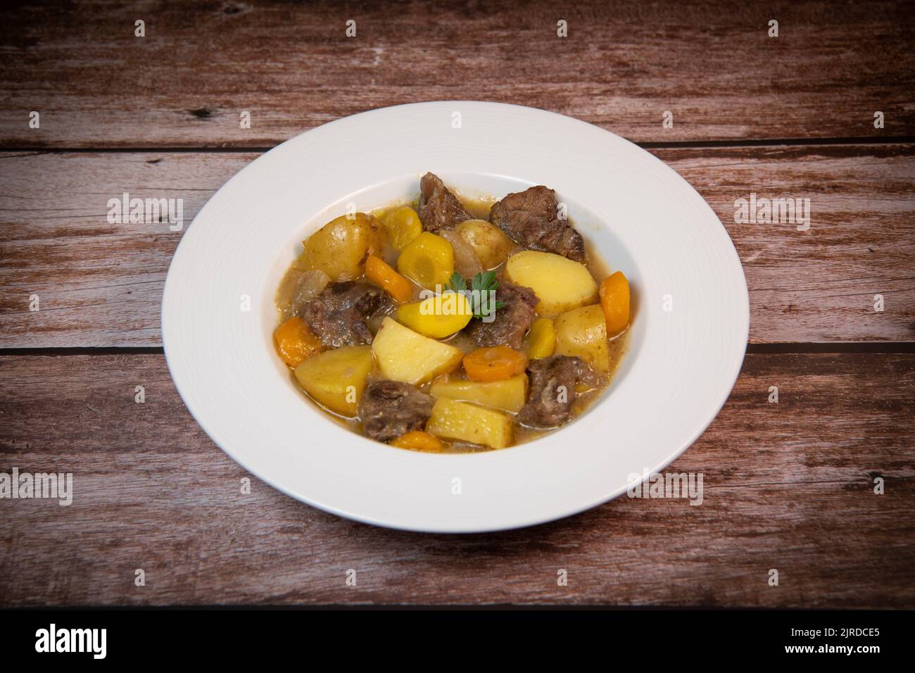 Recipe for beer and mustard beef chuck stew with potatoes, turnips and