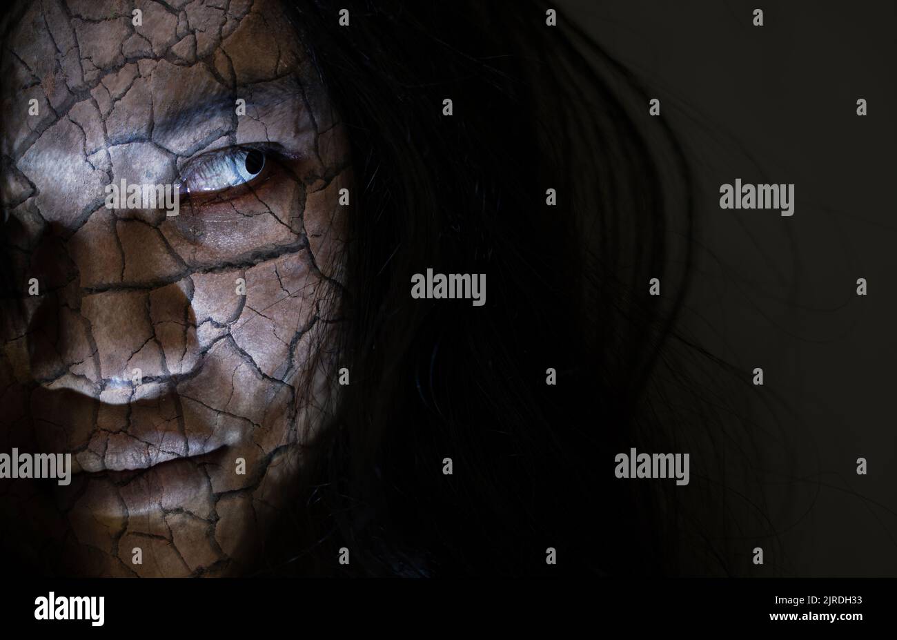Scary ghost woman. Close up face of Asian woman ghost or zombie horror creepy scary have hair covering the face her eye at abandoned dark tone, female Stock Photo