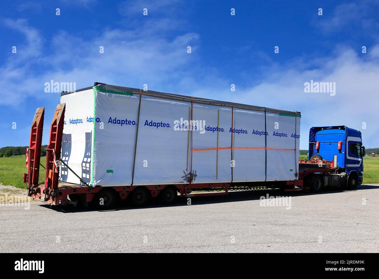 Oversize load transport of Adapteo prefabricated house module parked on a truck stop. Salo, Finland. June 14, 2020. Stock Photo