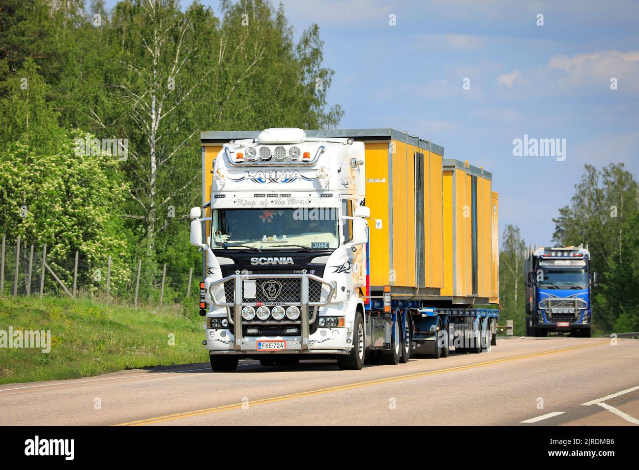 White customised Scania truck Lahma-Trans Oy hauls portable cabins as wide load transport in highway 9 lorry traffic. Orivesi, Finland. June 6, 2019. Stock Photo