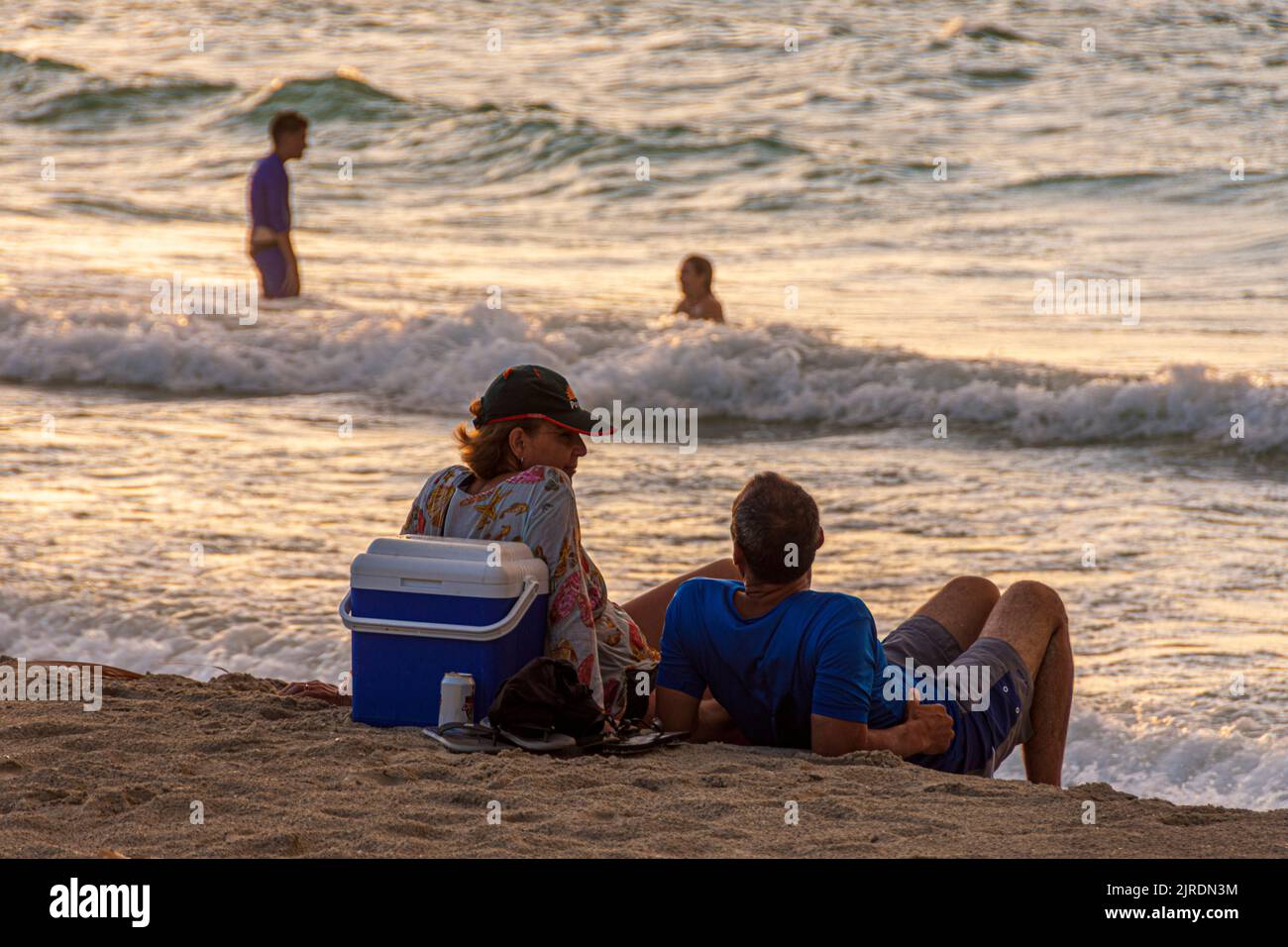 A couple on Varadero Beach, at sundown, Varadero, Cuba. Stock Photo