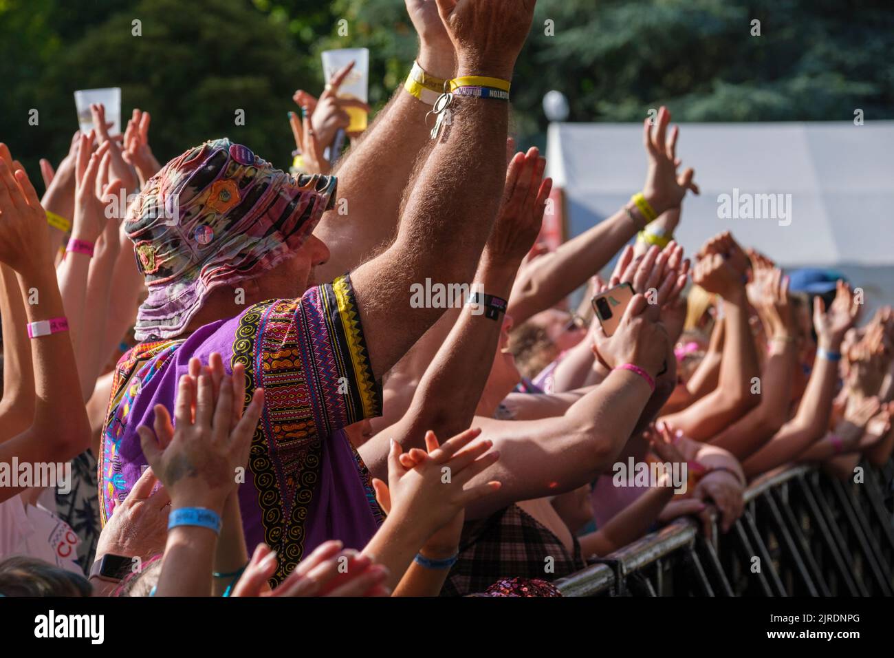 Fans cheering Scouting for Girl who are performing on main stage at Weyfest Festival, Tilford, England, UK. August 20, 2022 Stock Photo