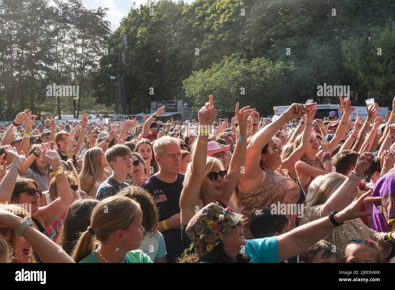 Fans cheering Scouting for Girl who are performing on main stage at Weyfest Festival, Tilford, England, UK. August 20, 2022 Stock Photo