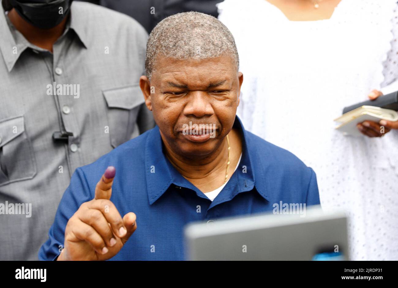 Angola's President and leader of the People's Movement for the Liberation of Angola (MPLA) ruling party, Joao Lourenco, gestures after castsing his vote in the general election in the capital Luanda, Angola August 24, 2022. REUTERS/Siphiwe Sibeko Stock Photo
