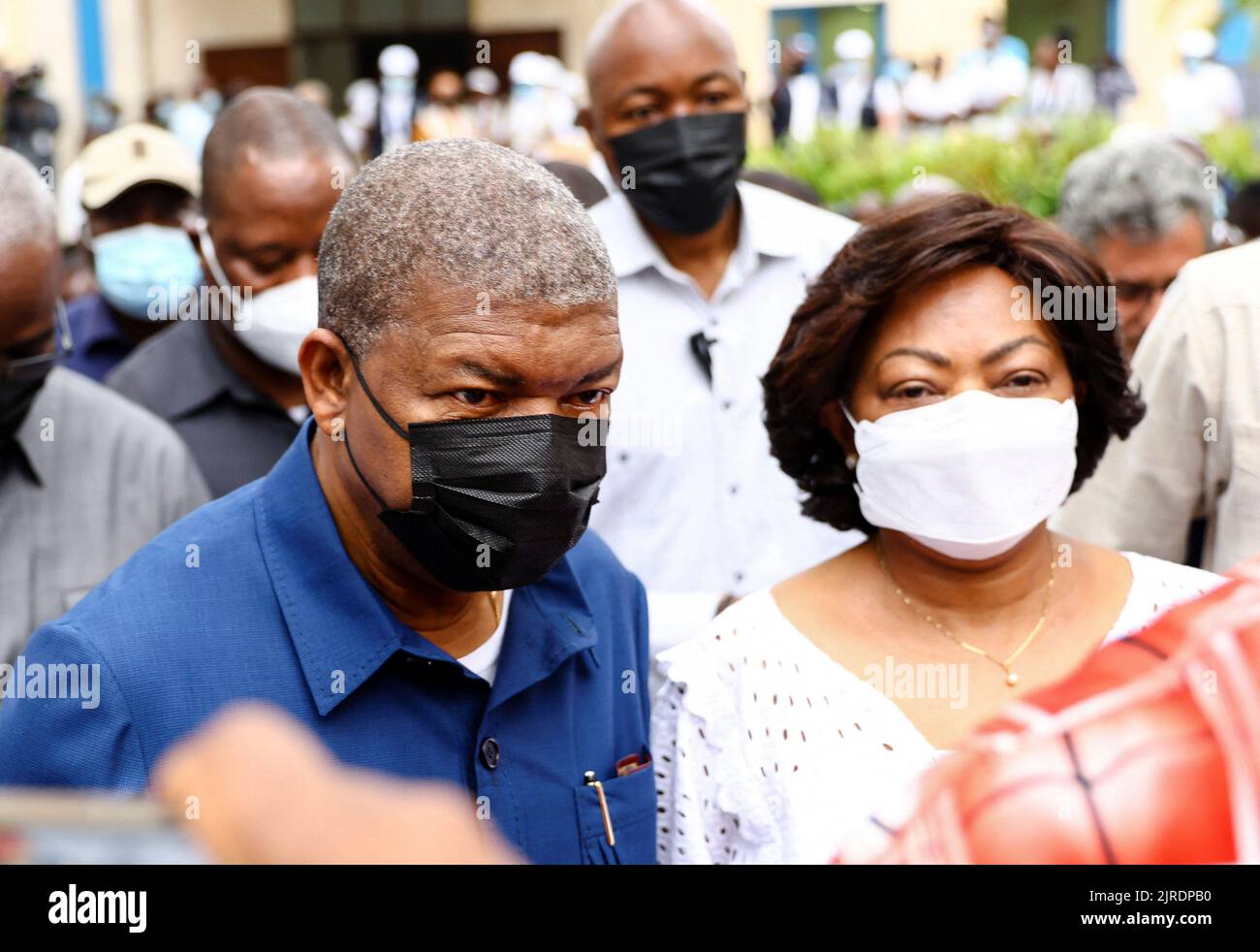 Angola's President and leader of the People's Movement for the Liberation of Angola (MPLA) ruling party, Joao Lourenco, leaves accompanied by his wife Ana Dias Lourenco, after casting his vote in the general election in the capital Luanda, Angola August 24, 2022. REUTERS/Siphiwe Sibeko Stock Photo