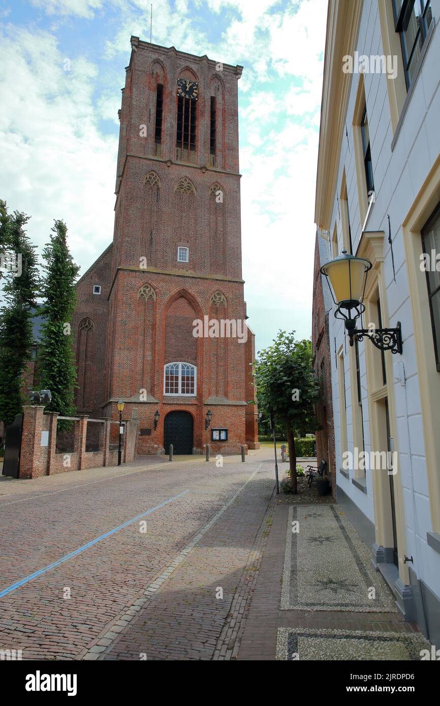 The impressive tower of the historic Nicolaas church (Nicolaaskerk) in Elburg, Gelderland, Netherlands, viewed from Van Kinsbergenstraat street Stock Photo